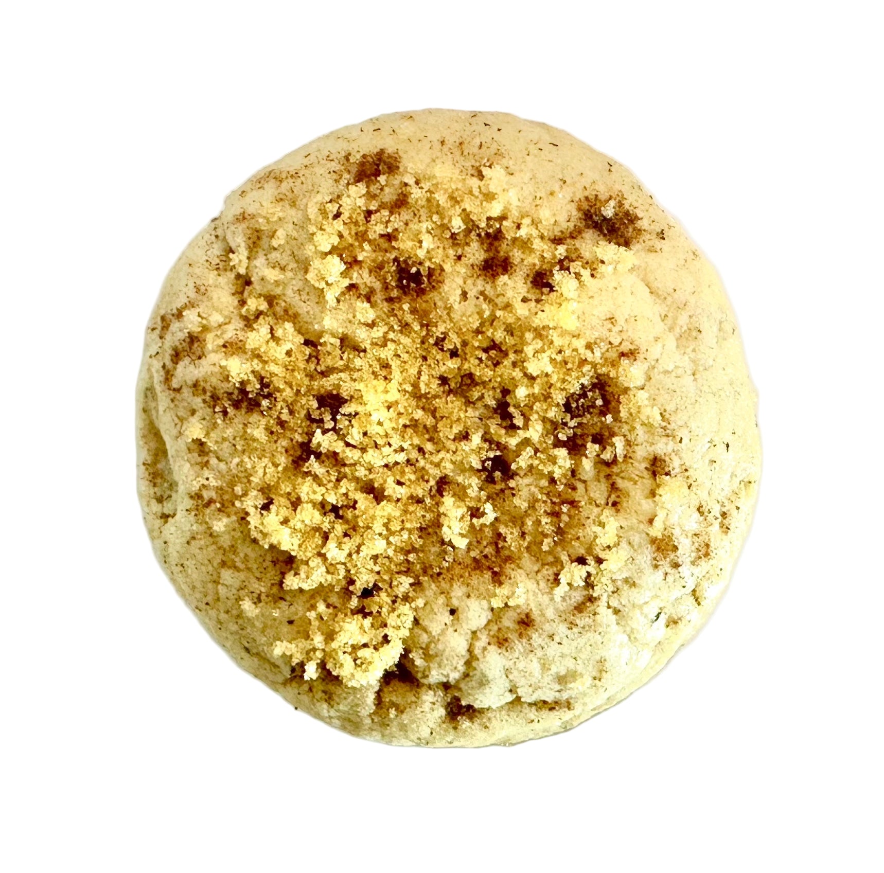 Round cookie topped with brown sugar and spices on a white background