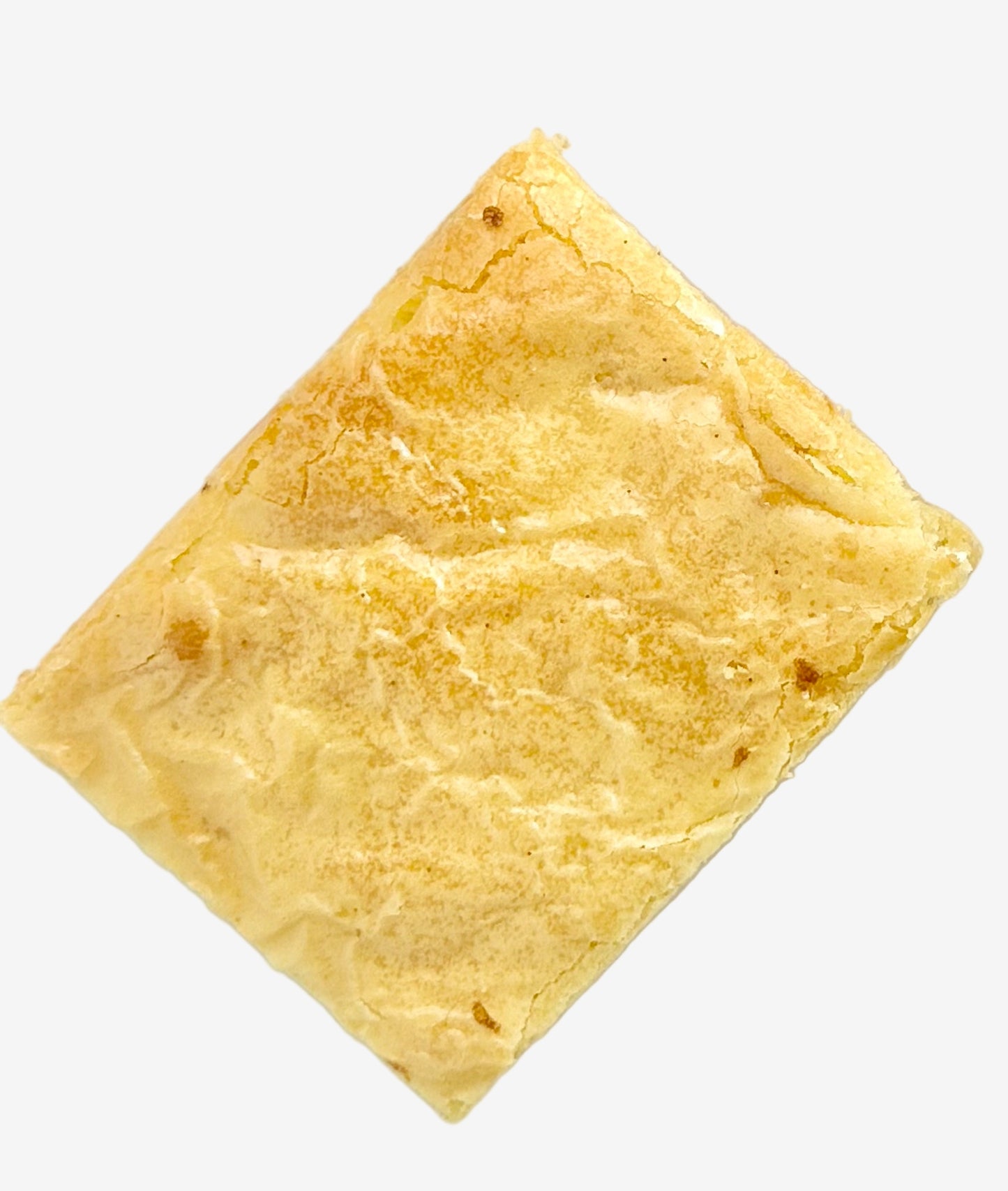 Rectangular white chocolate brownie on a white background