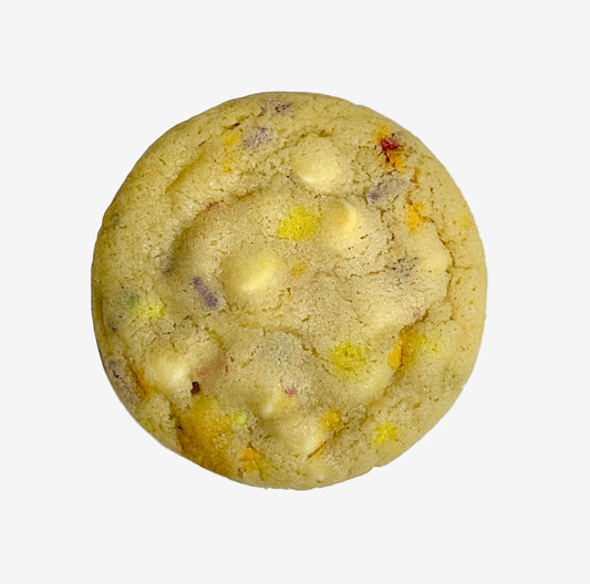 Cookie with white chocolate chips and sprinkles on a white background