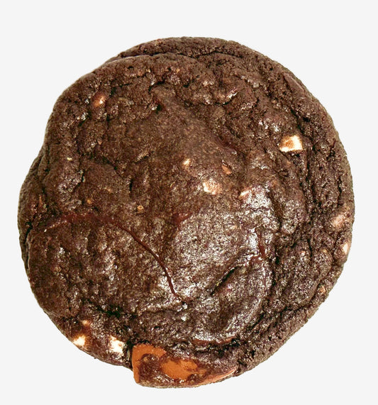 Chocolate cookie with white, milk, and dark chocolate chunks on a white background