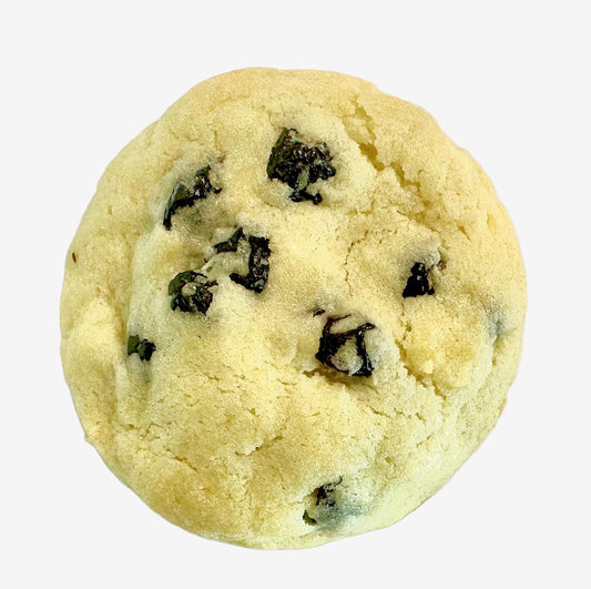 Cookie with blueberries and lemon zest on a white background