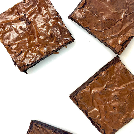 Four brownies on a white background